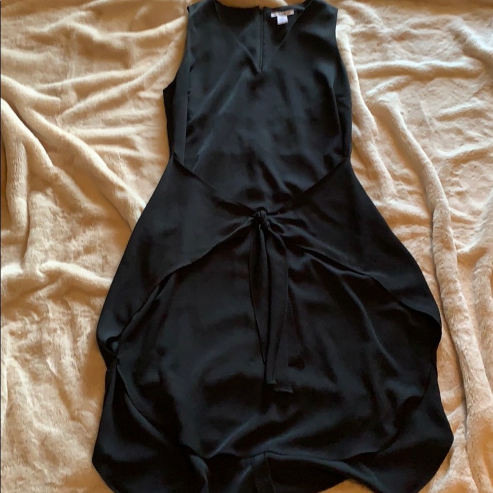 Sleeveless black dress with tie detail